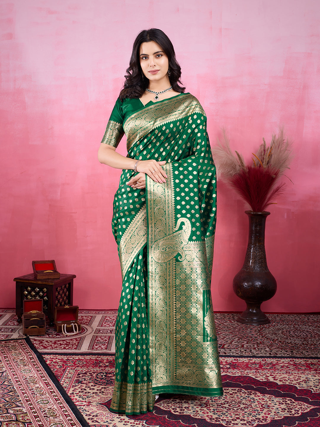 A beautiful green Banarasi silk saree with intricate golden jacquard zari woven patterns.