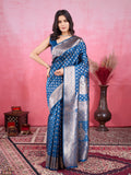 Woman wearing a deep peacock blue Morpinch Banarasi silk saree with silver metallic zari jacquard work