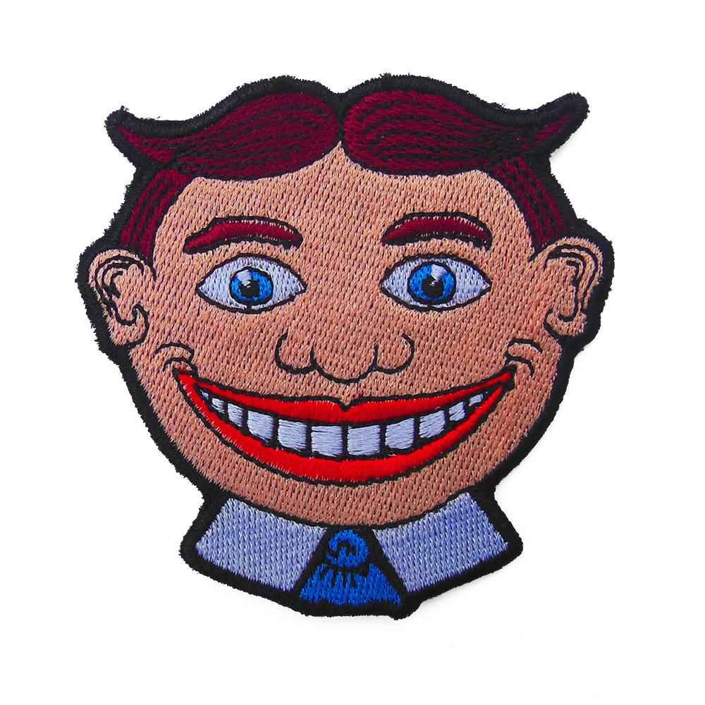 Classic Tillie embroidered patch in red, blue, tan, and black.