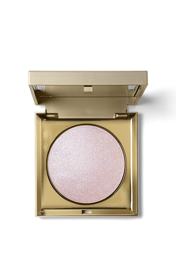 Stila Heaven's Hue Highlighter in a metallic gold compact showing shimmering powder finish