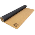 Foldable Nomad Air cork yoga mat in natural tan, showing the high-grip rubber underside.