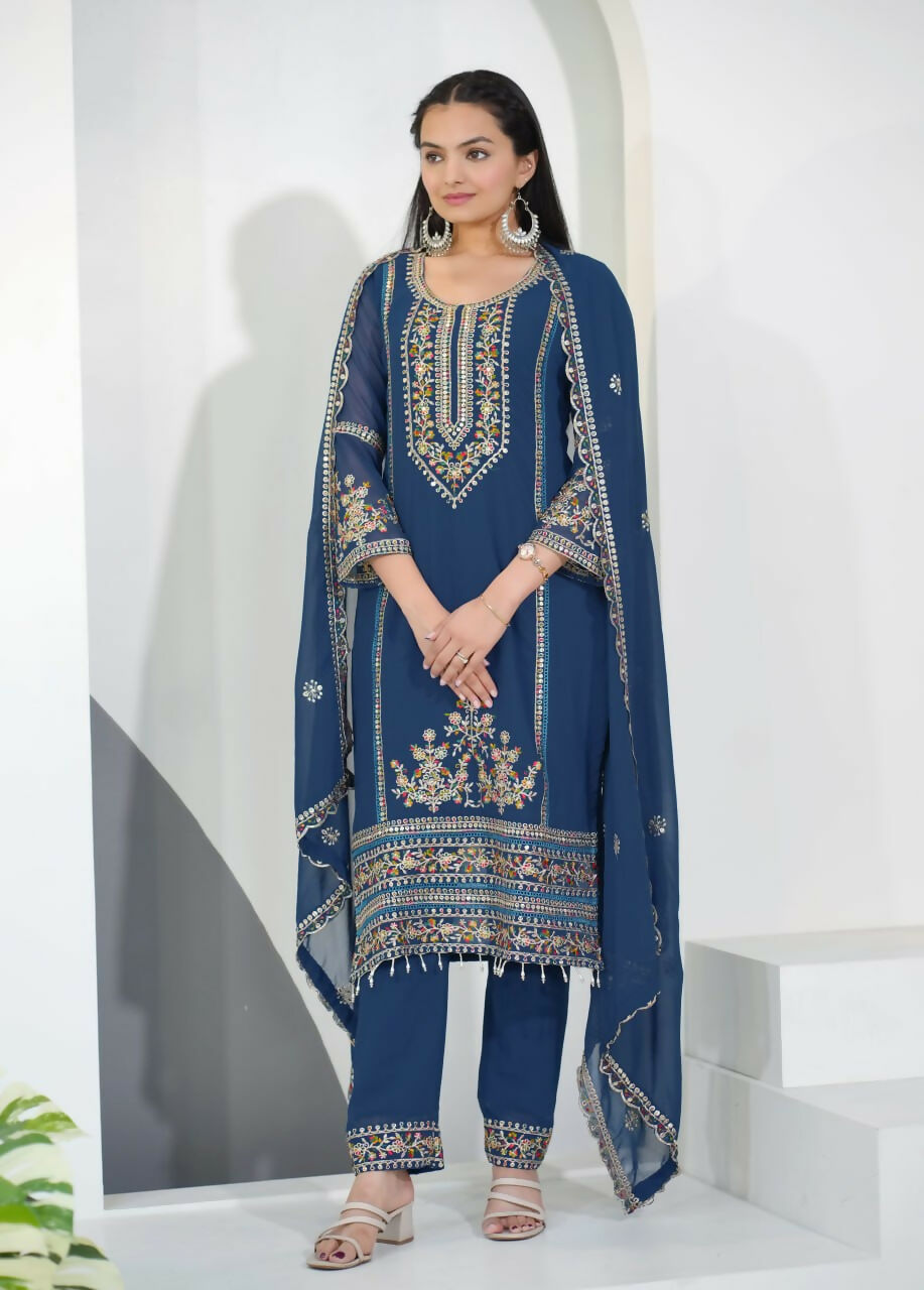 Woman wearing a blue georgette embroidered kurti set with matching pants and dupatta