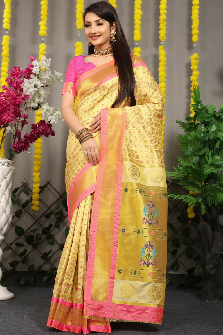 Cream Banarasi Silk saree with detailed zari weaving and a contrasting pink blouse