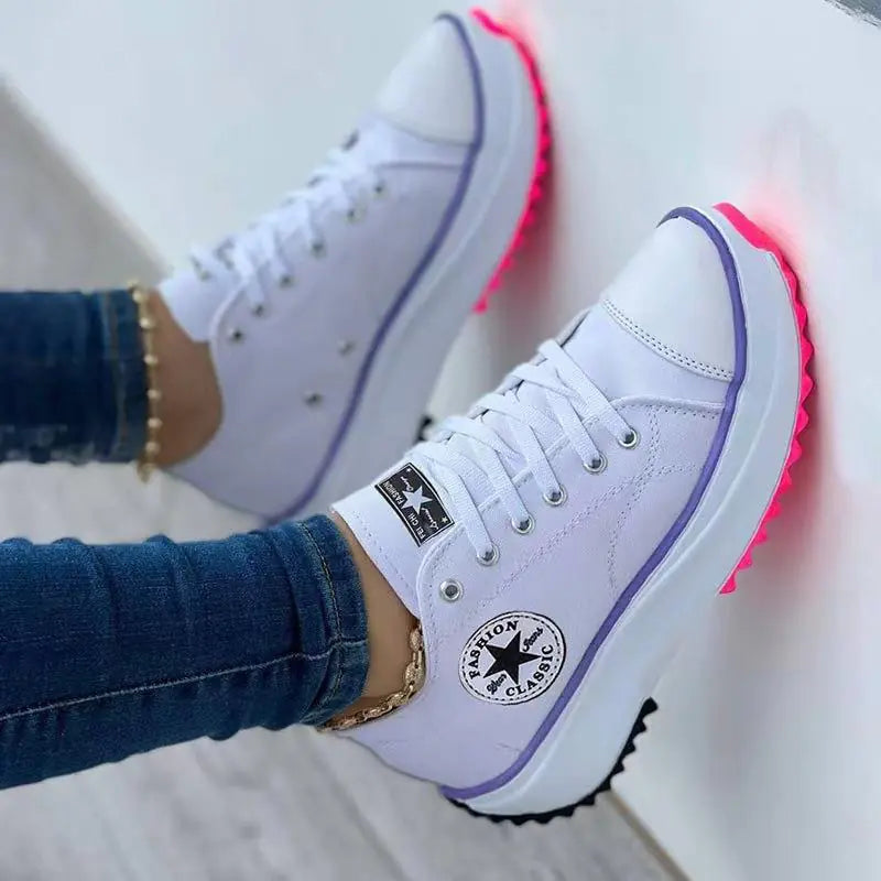 Women's high top canvas sneakers featuring a T-strap design and pointed toe