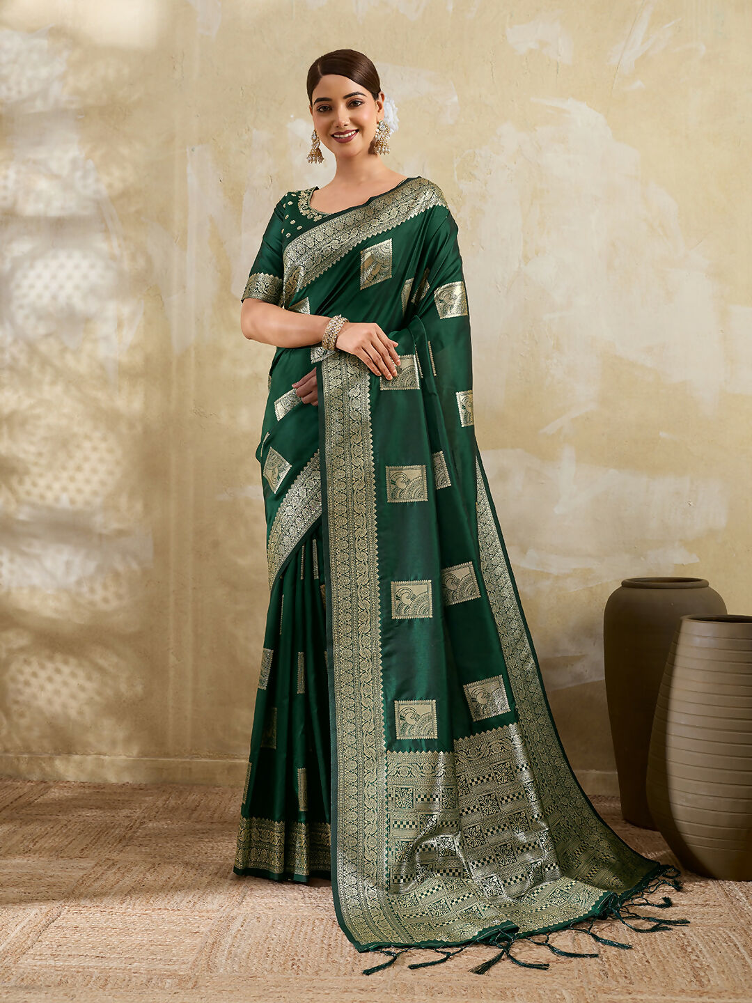 Dark green silk blend saree with elegant drape and matching blouse piece
