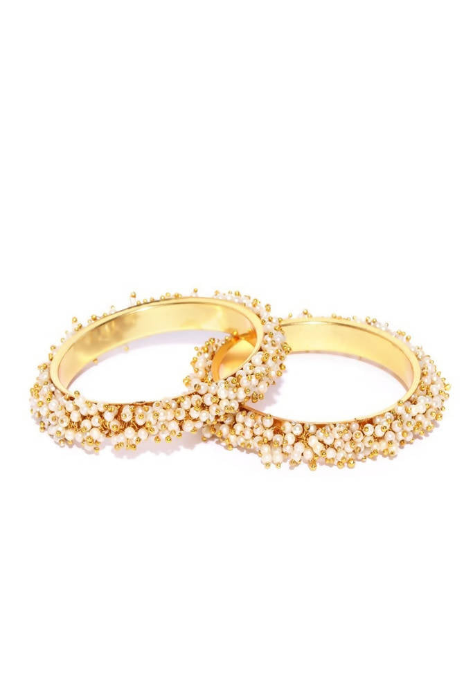 Set of golden off-white bangles adorned with elegant pearls