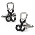 Silver and black stethoscope shaped cufflinks displayed on a white surface
