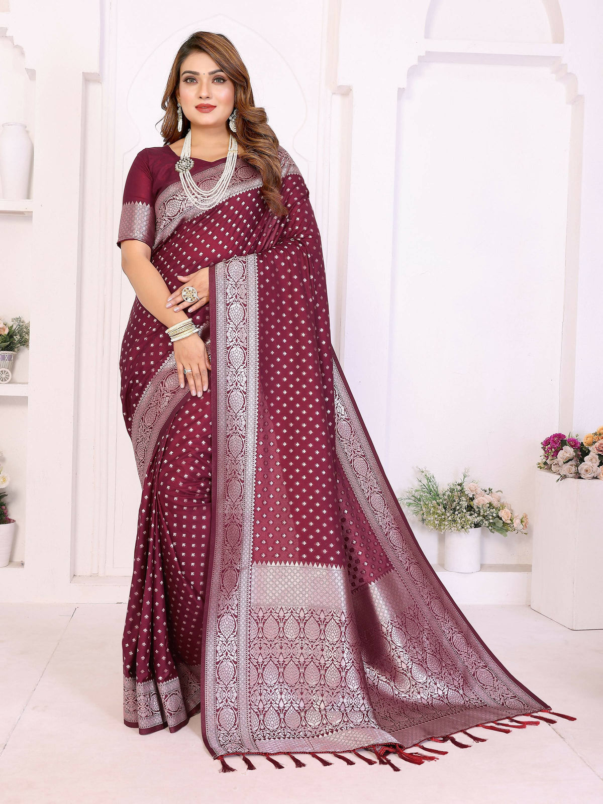 Wine colored georgette silk saree with intricate gold zari weaving detail