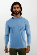 Model wearing a blue long-sleeve performance hoody with UPF 50 protection