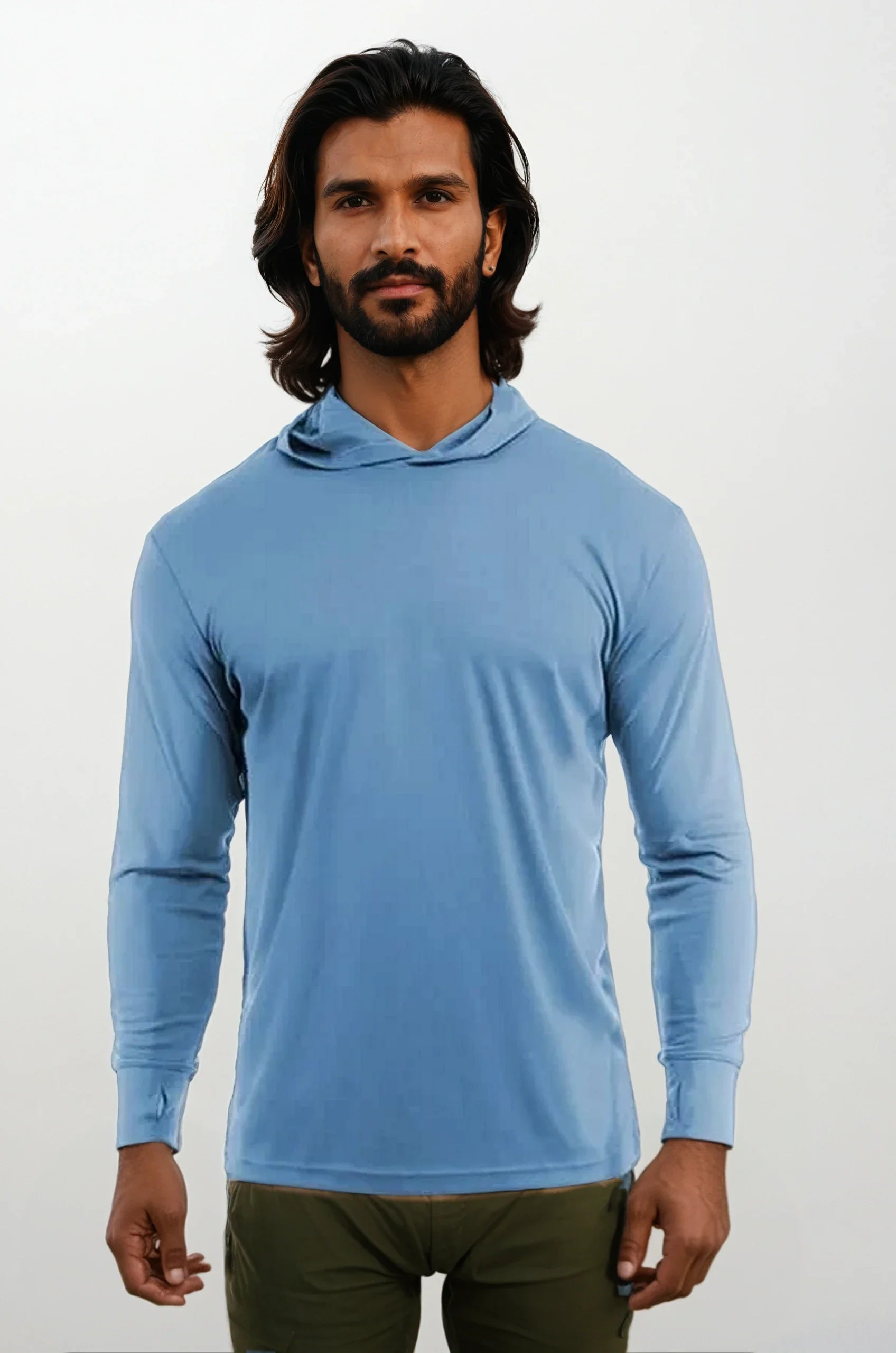 Model wearing a blue long-sleeve performance hoody with UPF 50 protection