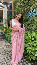 Soft pink poly chiffon saree with silver zari lines and a white Lucknowi blouse