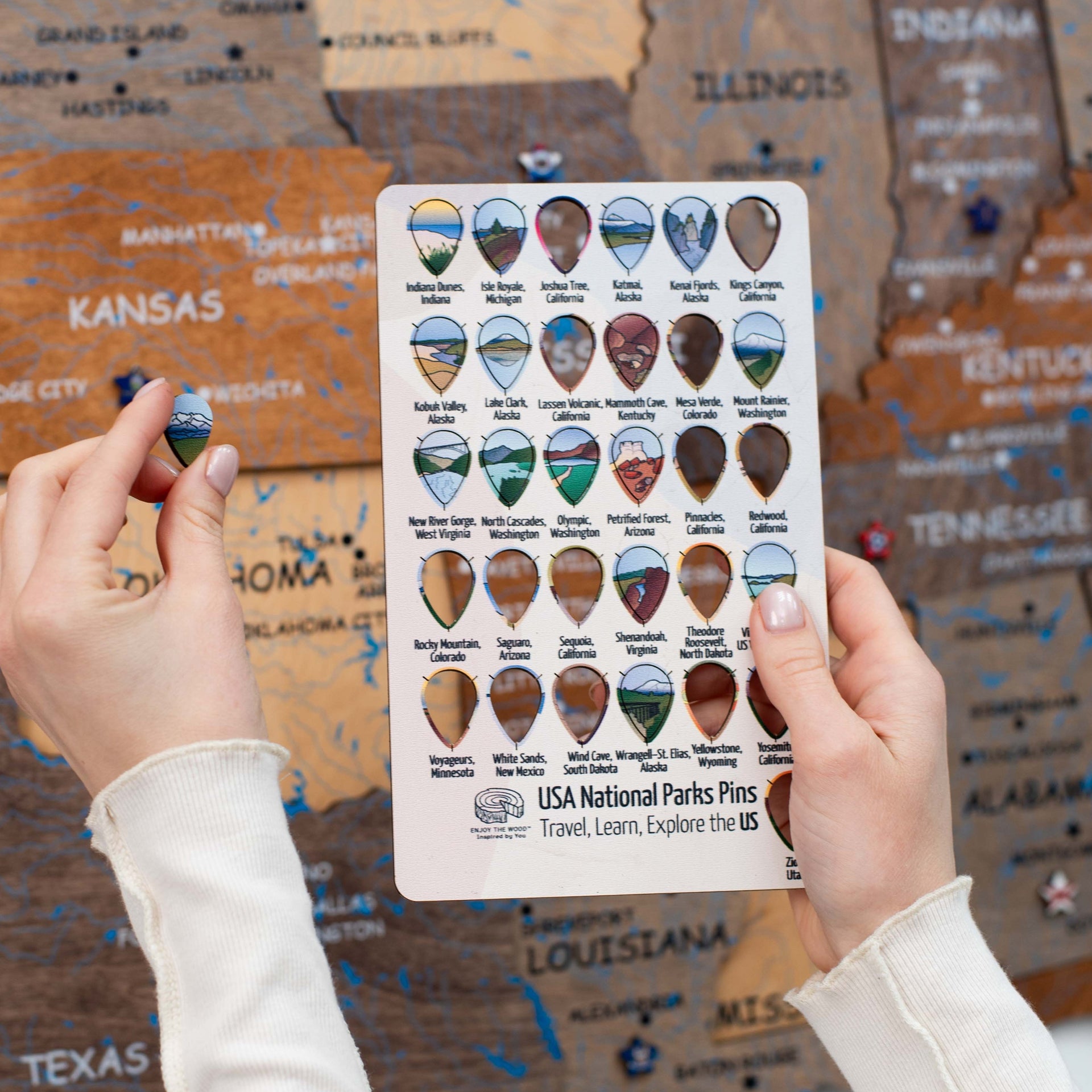 Collection of wooden US National Park sticky pins featuring custom illustrations.
