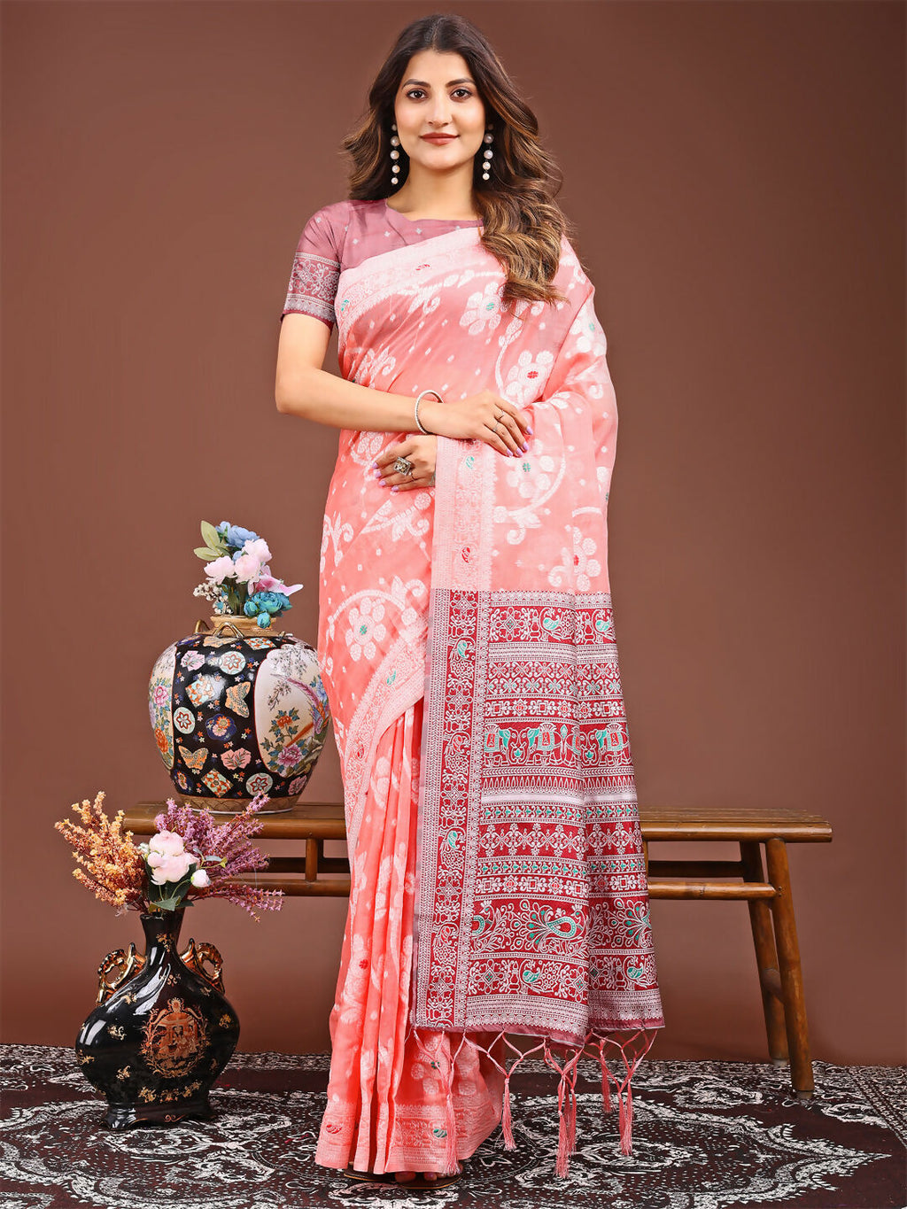 Peach colored linen cotton saree drape displaying natural fabric texture
