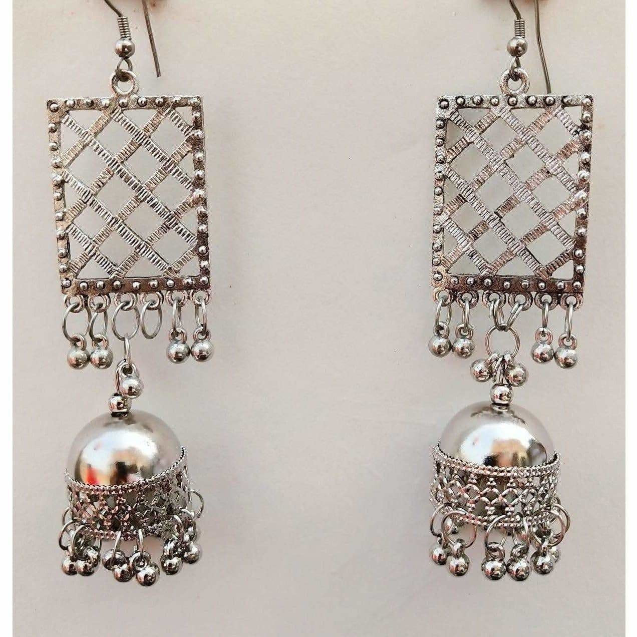 Silver oxidized jhumka earrings with tassel details for party wear