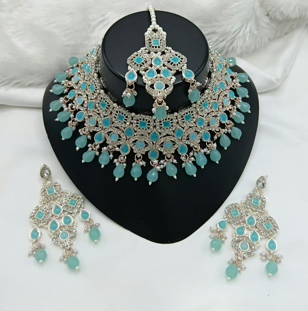 Exquisite blue stone work necklace and matching earring set displayed against a neutral background