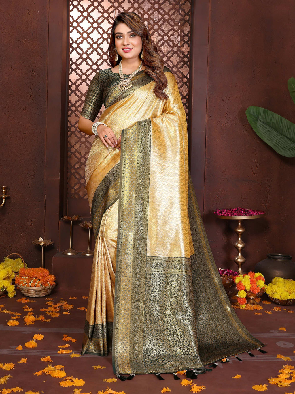 A close-up view of a cream tissue silk woven saree with delicate traditional patterns.