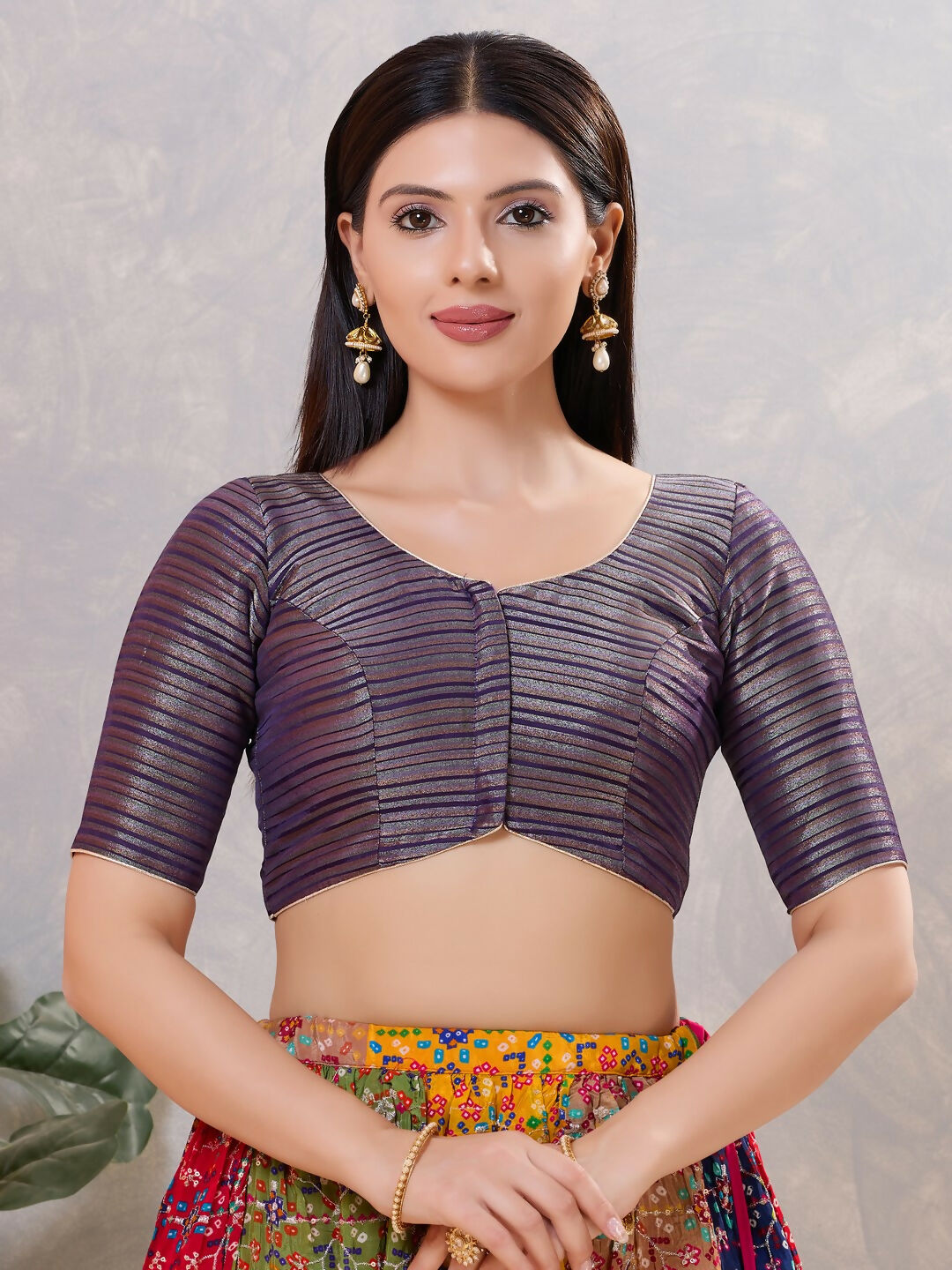 Front view of a Brinjal colored silk stitched blouse with a V-neck