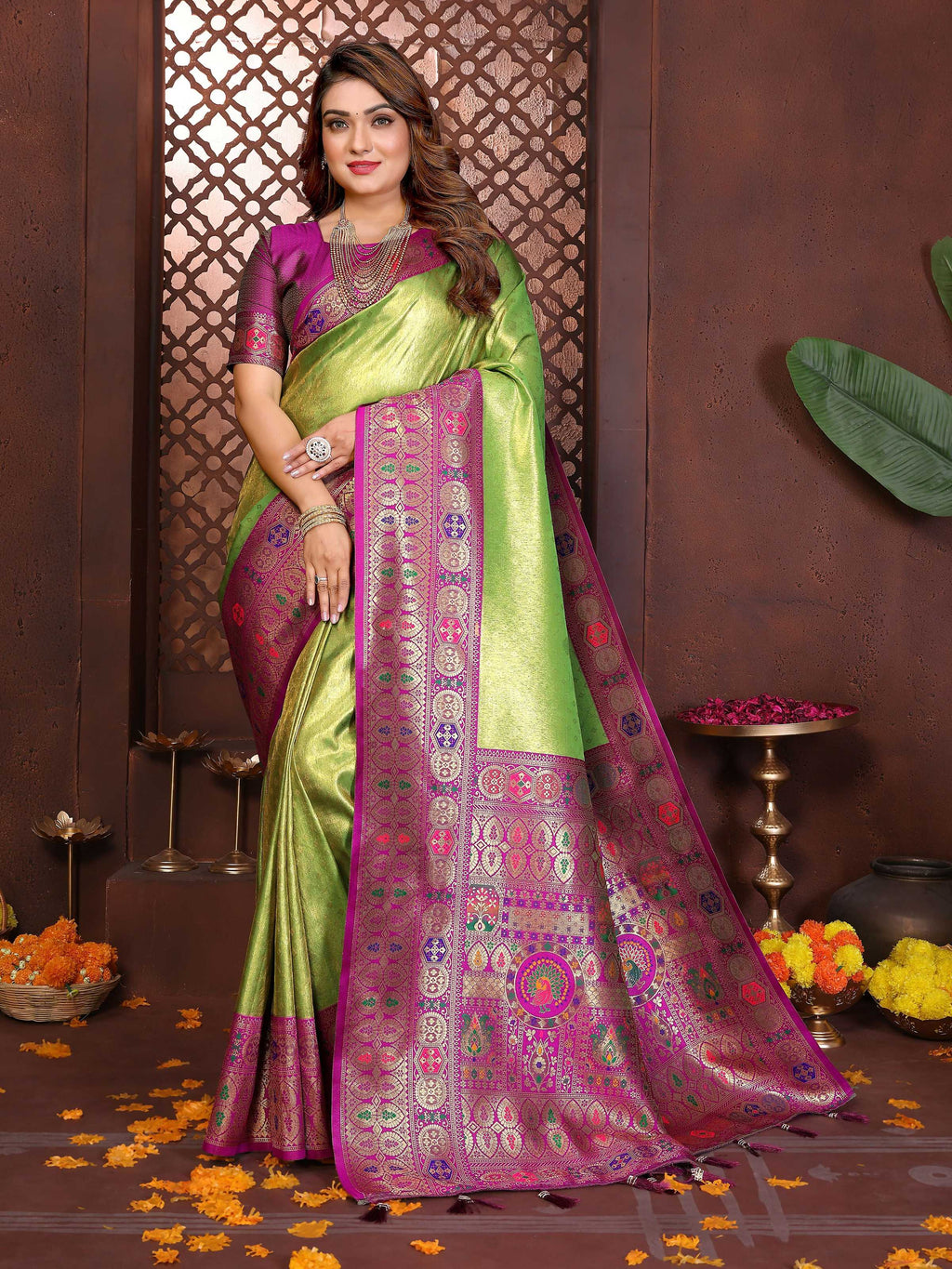 Green tissue silk saree with weaving details and a metallic sheen