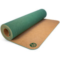 Minimalist Unity Pro cork and natural rubber yoga mat featuring Yoloha tree logo