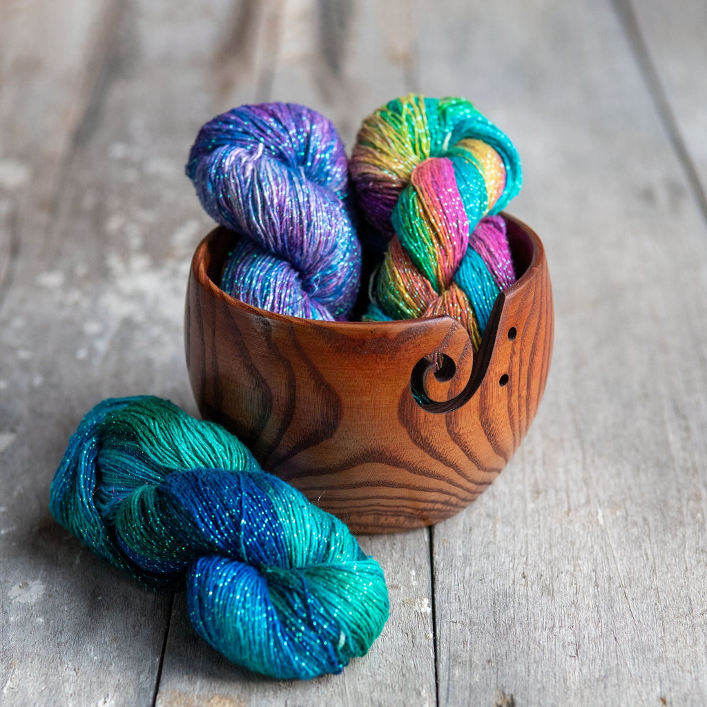Selection of limited edition small-batch yarn skeins in diverse, vibrant colorways