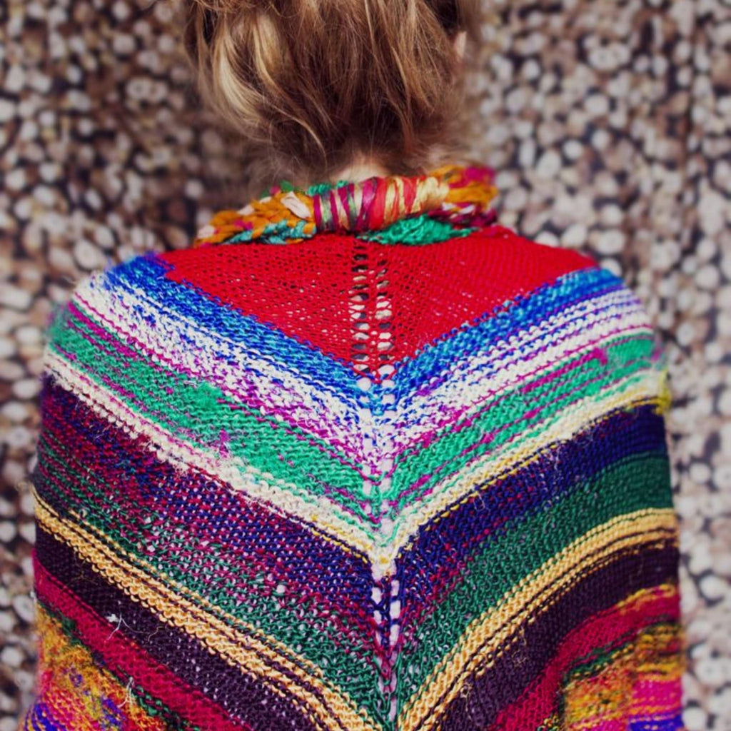 Moment of Zen Shawl Kit featuring a colorful, partially knitted handmade shawl on knitting needles.