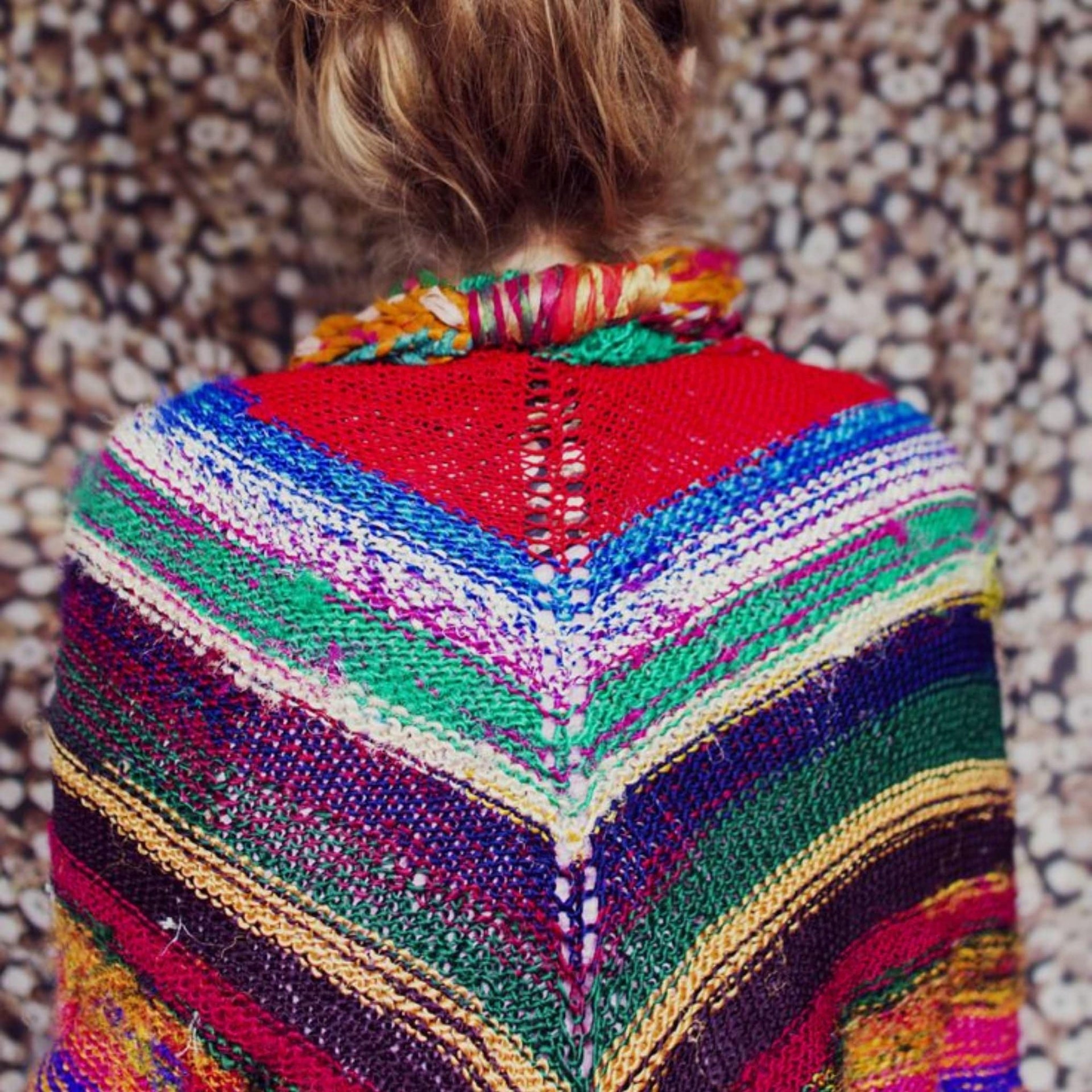 Moment of Zen Shawl Kit featuring a colorful, partially knitted handmade shawl on knitting needles.