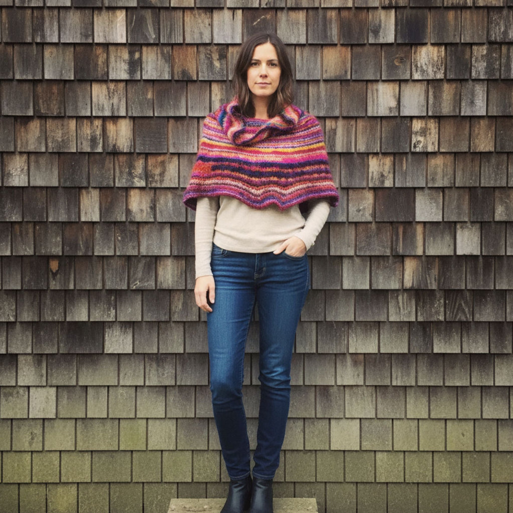 Vibrant knit cowl neck poncho created from a knitting pattern using Spice Market Yarn