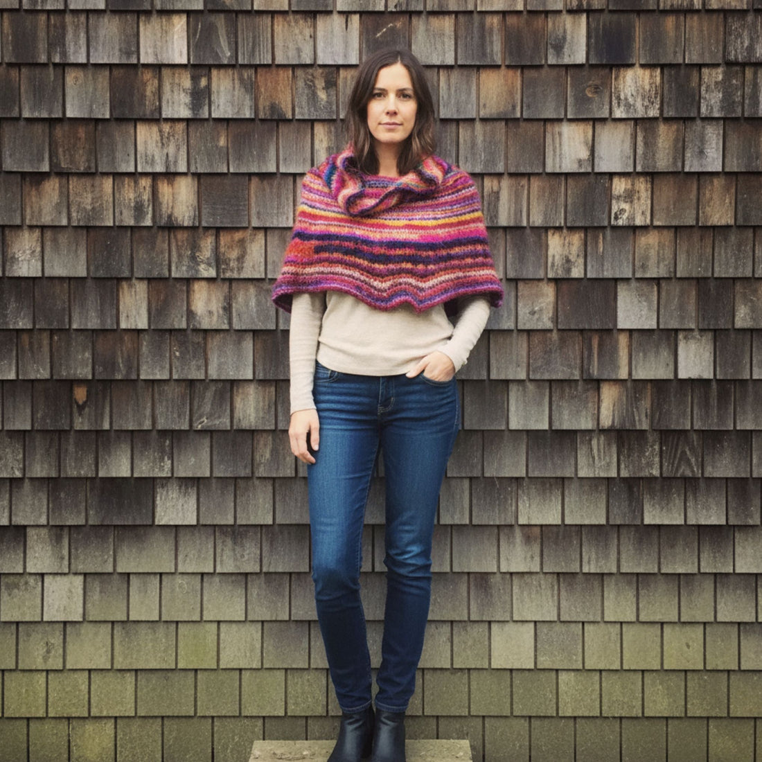 Vibrant knit cowl neck poncho created from a knitting pattern using Spice Market Yarn