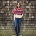 Vibrant knit cowl neck poncho created from a knitting pattern using Spice Market Yarn
