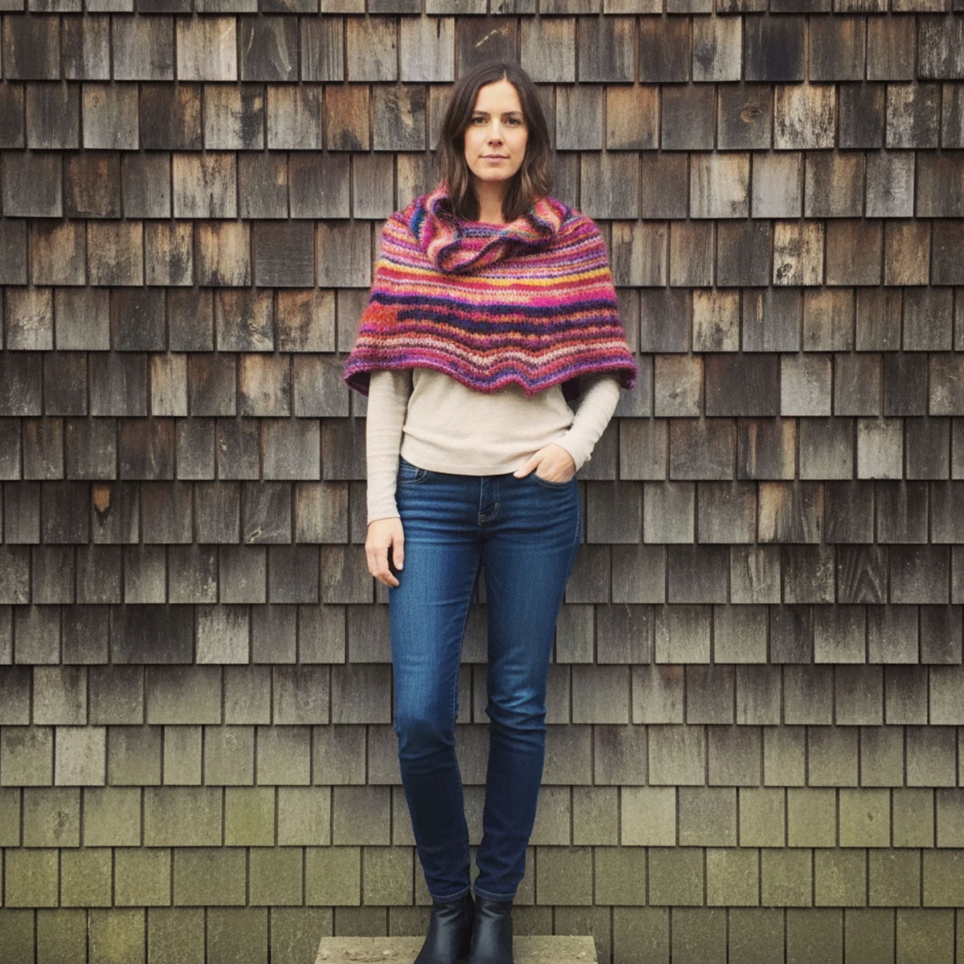 Vibrant knit cowl neck poncho created from a knitting pattern using Spice Market Yarn