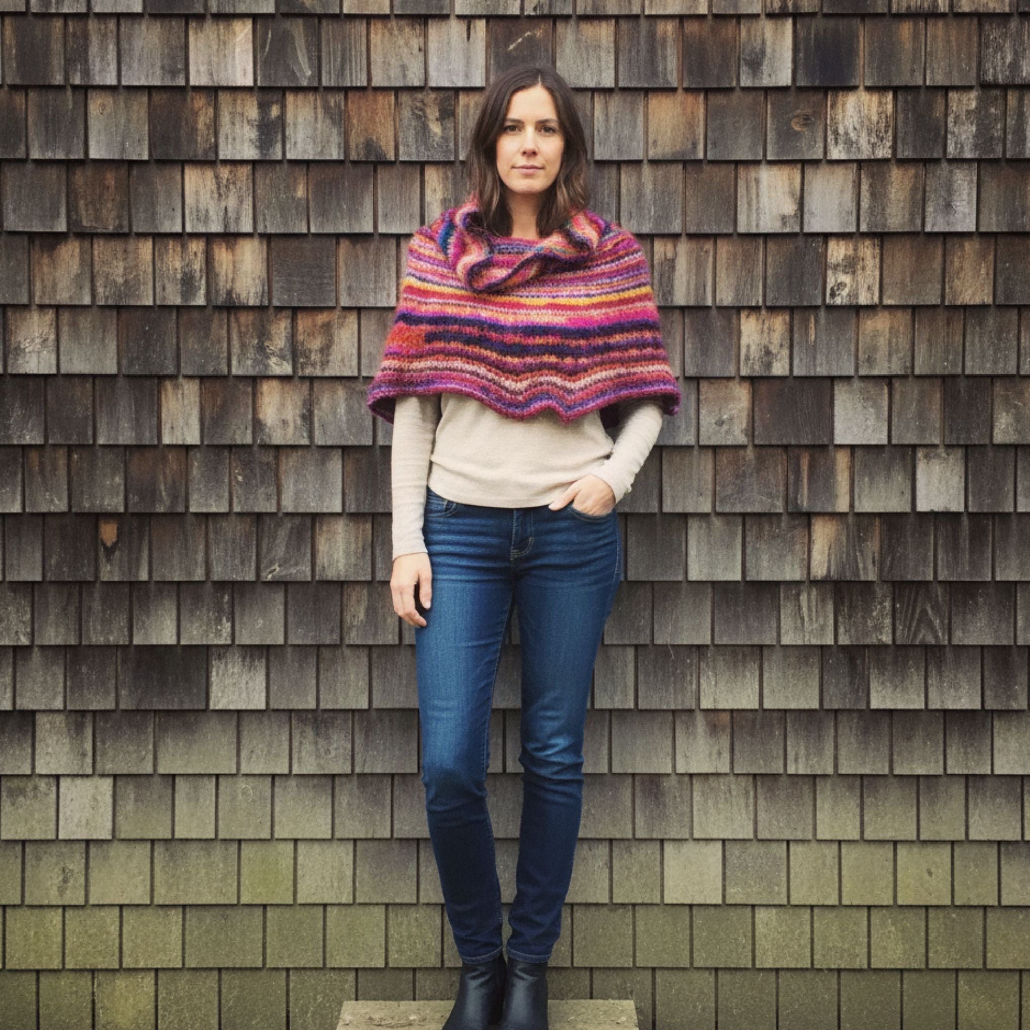 Vibrant knit cowl neck poncho created from a knitting pattern using Spice Market Yarn