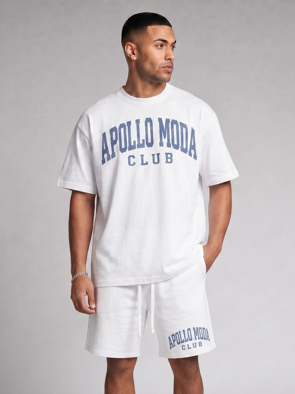 White oversized t-shirt with blue distressed collegiate lettering