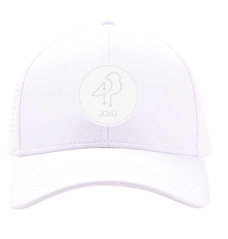 Woman wearing a white Joju performance sport hat with aerated sides outdoors.