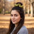Handmade triple ripple scrunchie and a pleated headband on a neutral background.