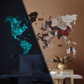 Geometric 3D luminous wooden world map in brown, white, red, and black.