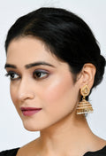 Golden Johar Kamal leaf design jhumka earrings decorated with white pearls and stones for girls.