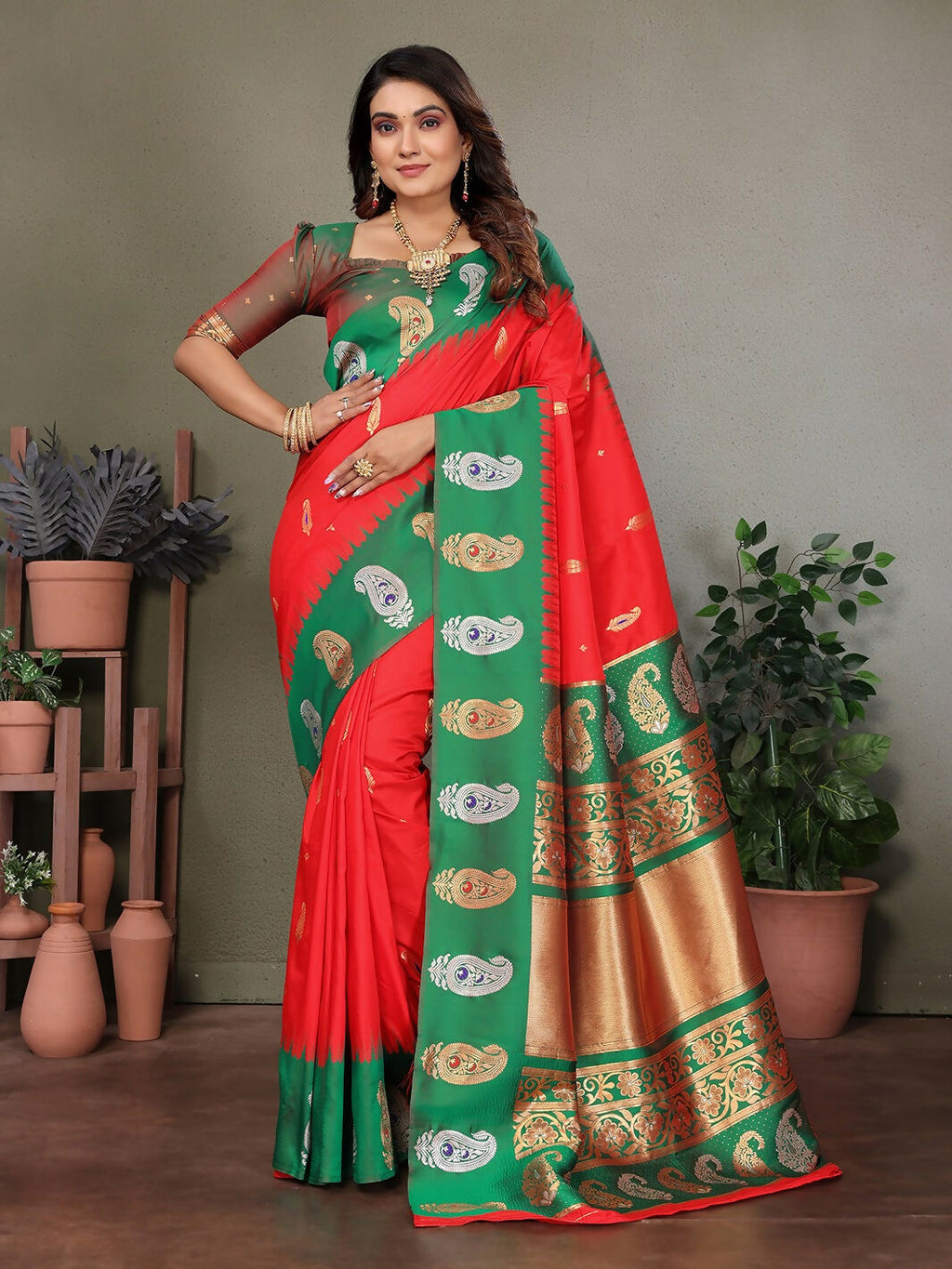 Red Banarasi soft silk saree featuring traditional butti work patterns