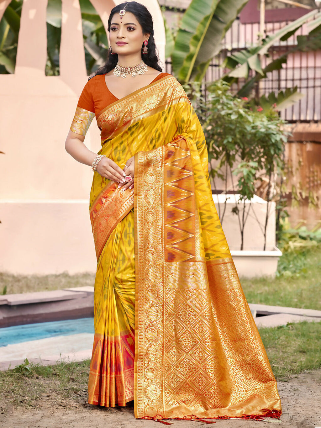 A beautiful vibrant yellow Pochampally silk saree with matching blouse fabric