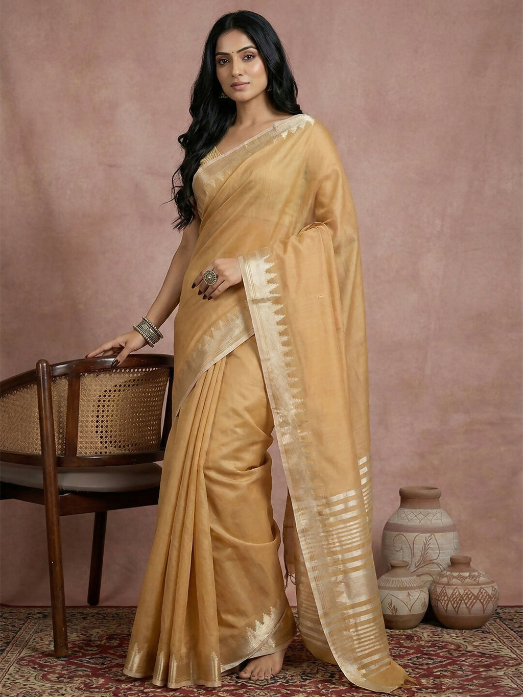 Elegant golden cotton saree with matching blouse piece draped gracefully
