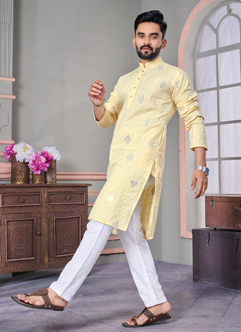 Men wearing a bright yellow linen kurta with intricate embroidery