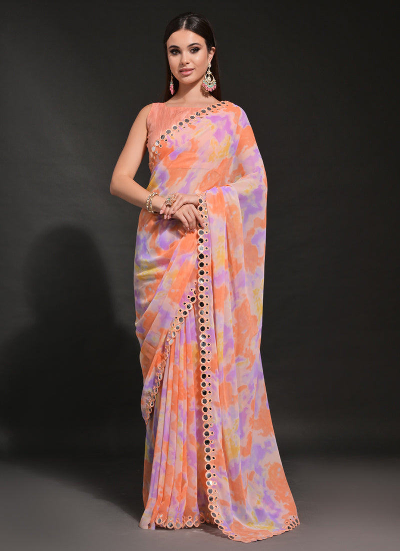 Bright orange georgette saree featuring prizam print and intricate mirror embroidery