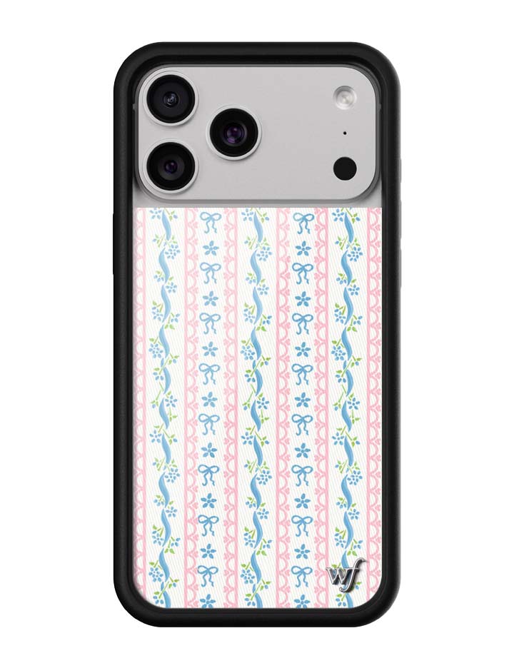 Dollhouse iPhone case with a white background featuring vertical pink lace stripes and small blue ribbons and flowers.