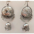 Oxidized silver chandbali jhumka earrings with tassel danglers on a clean background