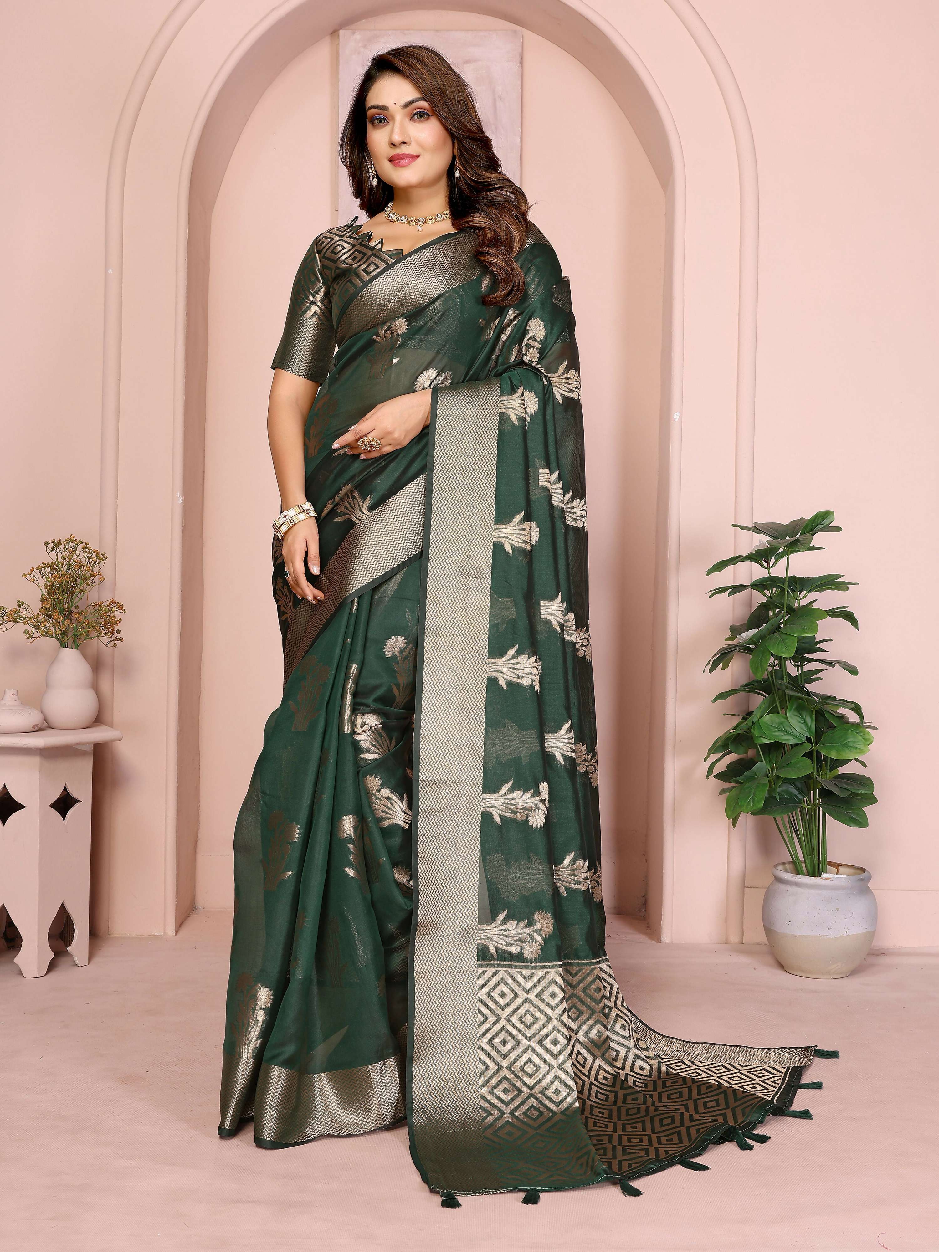 Dark green soft organza silk saree with detailed weaving patterns