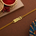 A stylish gold tone BRO rakhi designed as a sophisticated bracelet for men