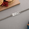 Silver tone BRO bracelet rakhi designed for men, worn as a stylish wrist accessory