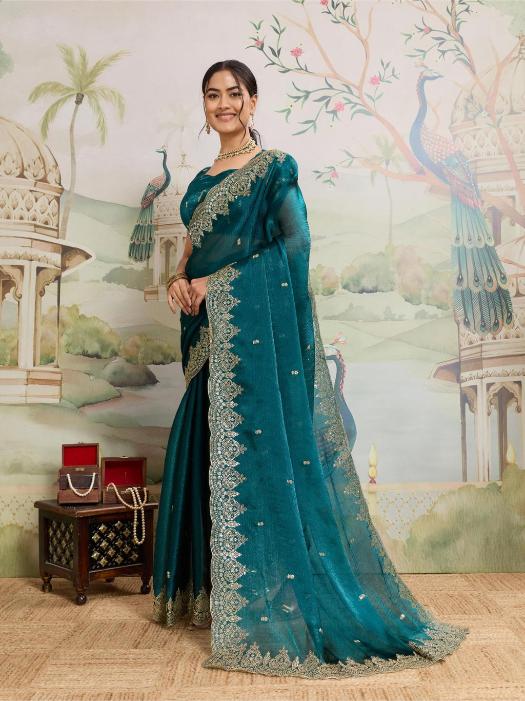 Teal Blue Jimmy Choo Organza saree with embroidery and unstitched blouse