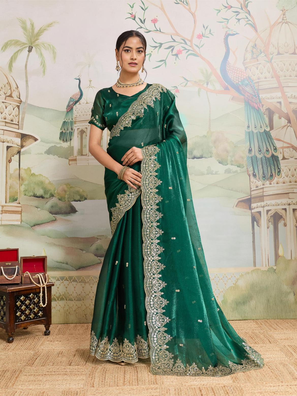 Elegant green Jimmy Choo organza saree with embroidery and unstitched blouse