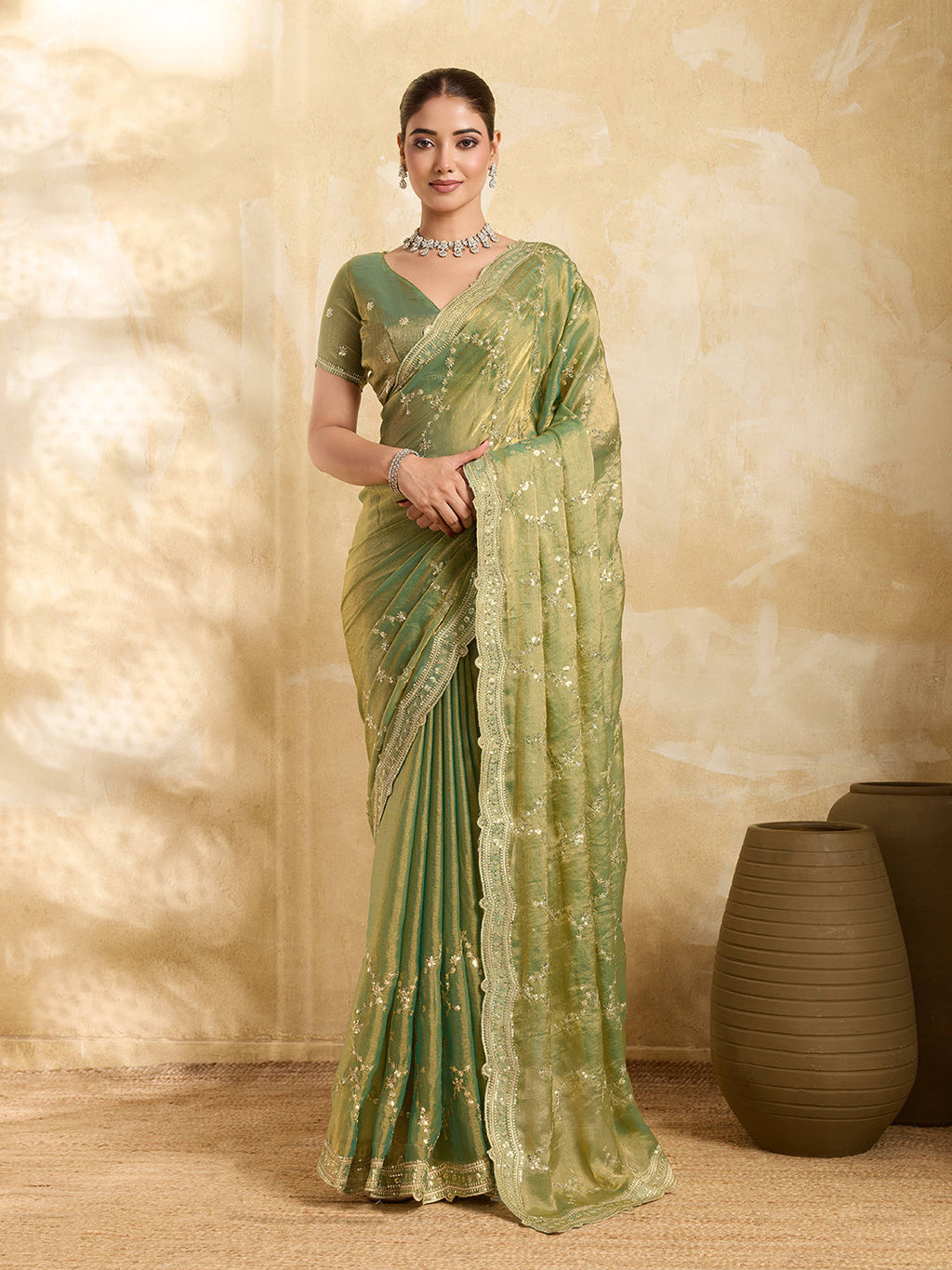 Mint green Jimmy Choo saree with sequence embroidery and unstitched blouse