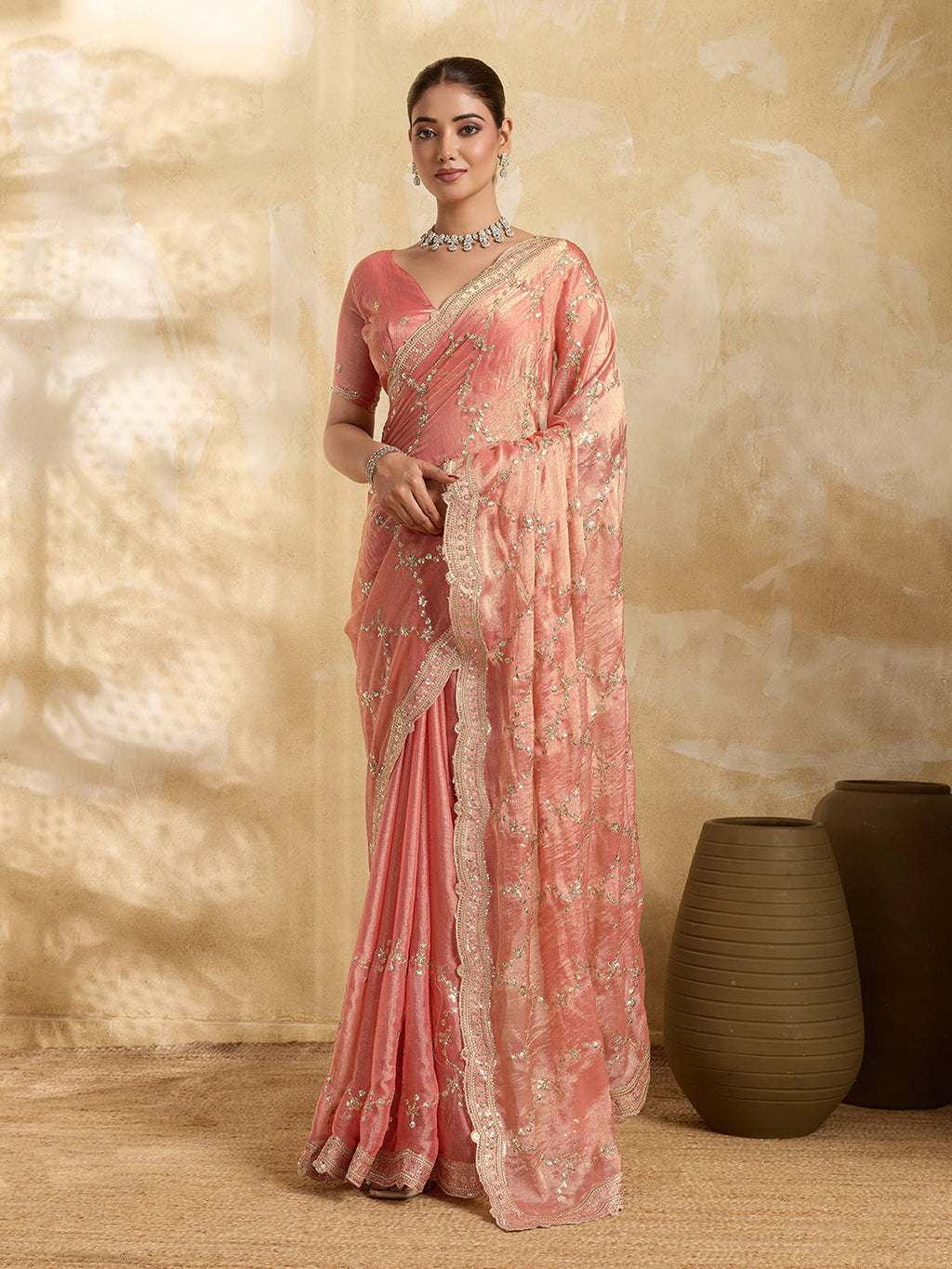 Peach Jimmy Choo party wear saree with sequin embroidery and matching unstitched blouse